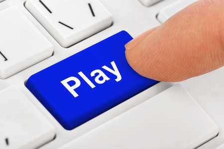 Computer notebook keyboard with Play key - technology backgroundの写真素材