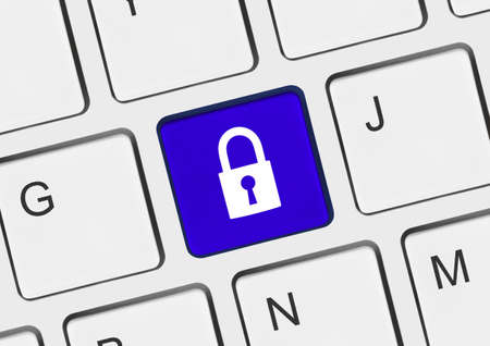Computer keyboard with security key - technology conceptの写真素材