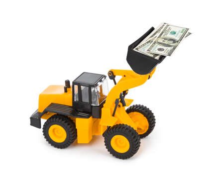 Toy loader and money isolated on white backgroundの写真素材