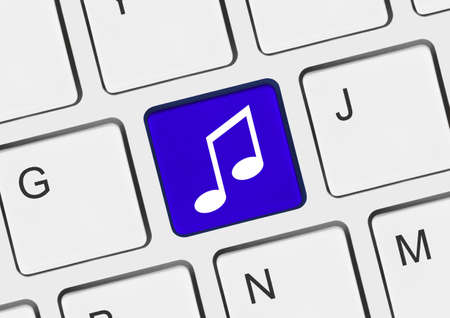 Computer keyboard with music key - technology backgroundの写真素材