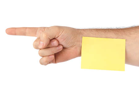 Hand and note paper isolated on white backgroundの写真素材