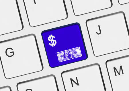 Computer keyboard with money key - business backgroundの写真素材
