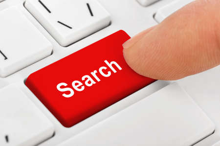 Computer notebook keyboard with Search key - technology background