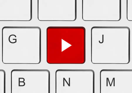 Computer keyboard with Play key - technology background