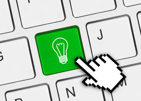 Computer keyboard with lamp key - technology backgroundの写真素材