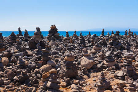 Stack of stones on beach in Tenerife island - Canary Spain