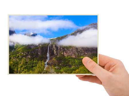 Norway travel photography in hand (my photo) isolated on white background