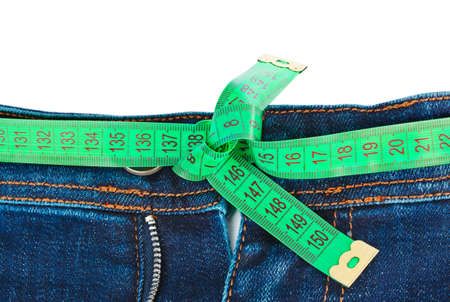 Jeans and measuring tape - slimming concept - isolated on white backgroundの写真素材