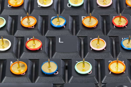 Pins on computer keyboard - concept backgroundの写真素材