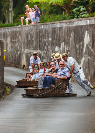 FUNCHAL, MADEIRA - SEPTEMBER 19: Traditional downhill sledge trip on September 19, 2016 in Madeira, Portugal.のeditorial素材