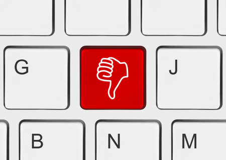 Computer keyboard with thumb gesturing hand keyの写真素材