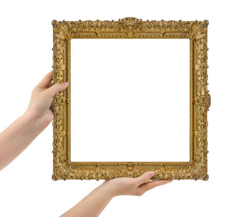 Wooden picture frame in hands isolated on white backgroundの写真素材