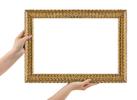 Wooden picture frame in hands isolated on white backgroundの写真素材