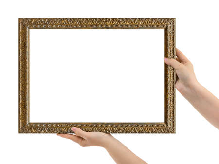 Wooden picture frame in hands isolated on white backgroundの写真素材