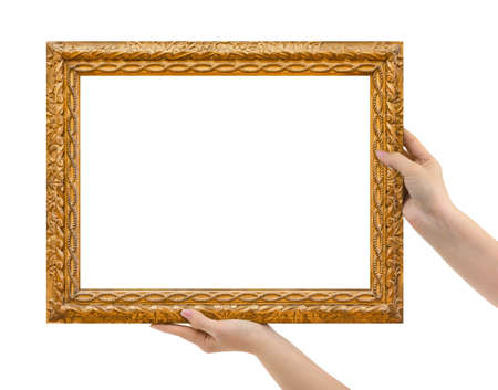 Wooden picture frame in hands isolated on white background