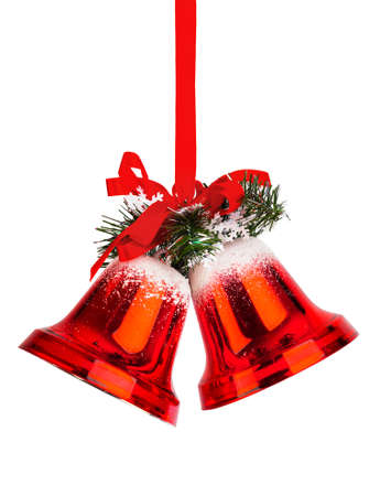 Christmas bells with a red bow isolated on white backgroundの写真素材