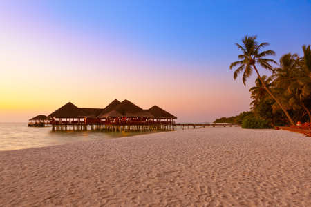 Water cafe at sunset - Maldives vacation backgroundのeditorial素材