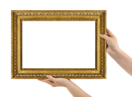 Wooden picture frame in hands isolated on white backgroundの写真素材