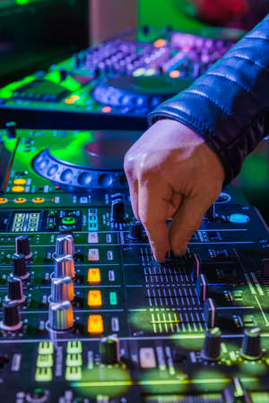 Dj playing the track in the nightclub at a party - Madame Tussauds Museum