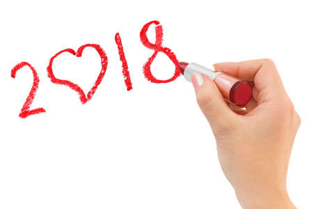 Hand with lipstick drawing 2018 isolated on white backgroundの写真素材