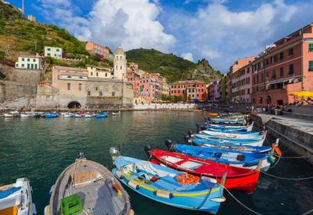 VERNAZZA, ITALY - AUGUST 17, 2016: Tourists walk by Vernazza in Cinque Terre on August 17, 2016 in Vernazza Italy.のeditorial素材
