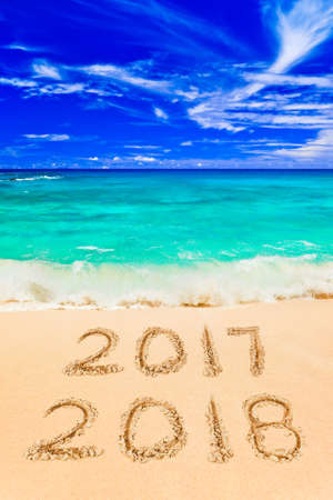 Numbers 2018 on beach - concept holiday background