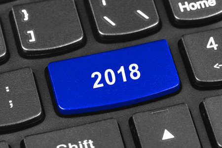 Computer notebook keyboard with 2018 key - holiday technology conceptの写真素材
