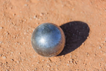 Petanque ball on the ground - sport backgroundの写真素材