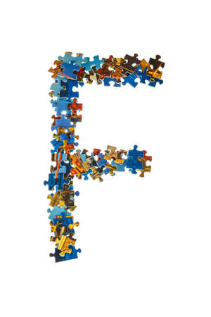 Letter F made of puzzle pieces isolated on white backgroundの写真素材