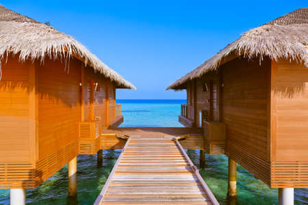 Bungalows on tropical Maldives island - nature travel backgroundの写真素材