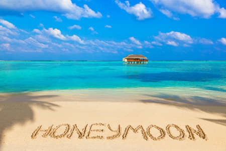 Word Honeymoon on beach - concept holiday backgroundの写真素材
