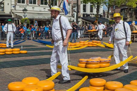Alkmaar, Netherlands - April 28, 2017: Cheese carriers at traditional cheese market.のeditorial素材
