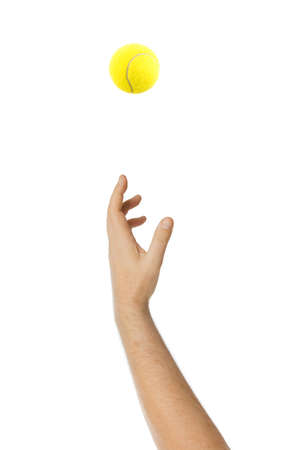 Hand giving service throwing tennis ball isolated on white backgroundの写真素材
