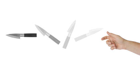 Hand is throwing a knife isolated on white backgroundの写真素材