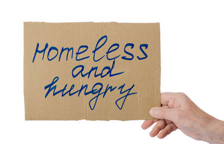 Hand of beggar with cardboard isolated on white background