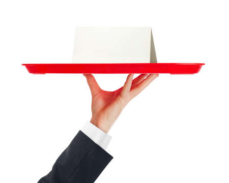 Hand and tray with paper card isolated on white backgroundの写真素材