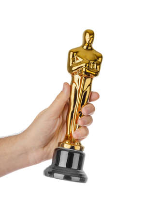 Hand with Award of Oscar ceremony isolated on white backgroundの写真素材