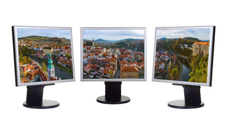 Cesky Krumlov panorama in Czech Republic (my photo) on computer monitors - isolated on white...