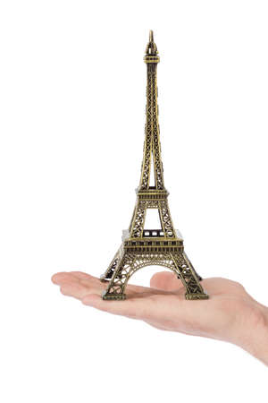 Paris Eiffel tower souvenir in hand isolated on white backgroundの写真素材