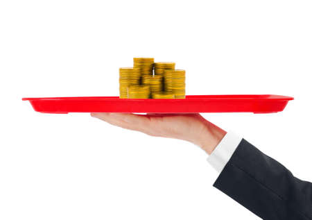 Hand and tray with money isolated on white backgroundの写真素材