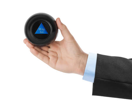 Magic ball with prediction Maybe in hand isolated on white background