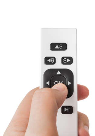 Hand with remote control of windows cleaning robot isolated on white background