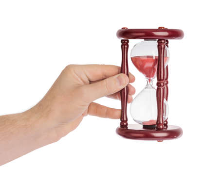 Hand with hourglass isolated on white background