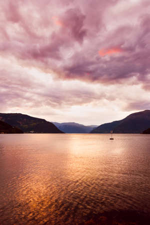 Sunset in fjord Hardanger Norway - nature and travel backgroundの写真素材