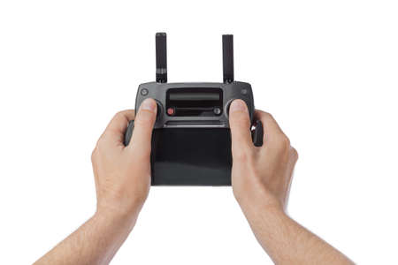 Radio remote control in hands - isolated on white background