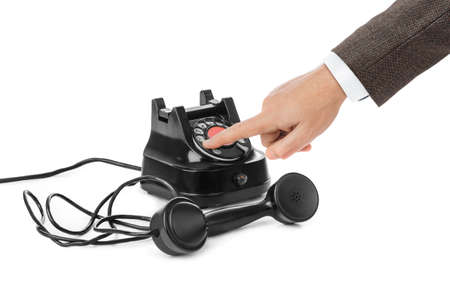 Hand and vintage telephone isolated on white backgroundの写真素材