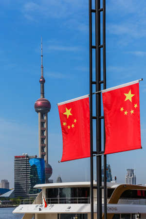 Shanghai, China - May 23, 2018: Chinese flag and modern Pudong skyline in Shanghai, China.のeditorial素材