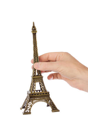 Paris Eiffel tower souvenir in hand isolated on white backgroundの写真素材