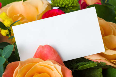 Roses bouquet and paper card - floral backgroundの写真素材