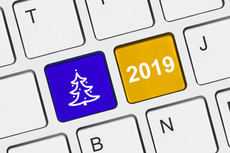 Computer keyboard with Christmas keys - holiday concept